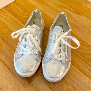 Fun shiny silver Keds-like shoes.